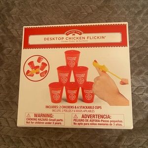 New in the box. Desktop Chicken Flickin game.
